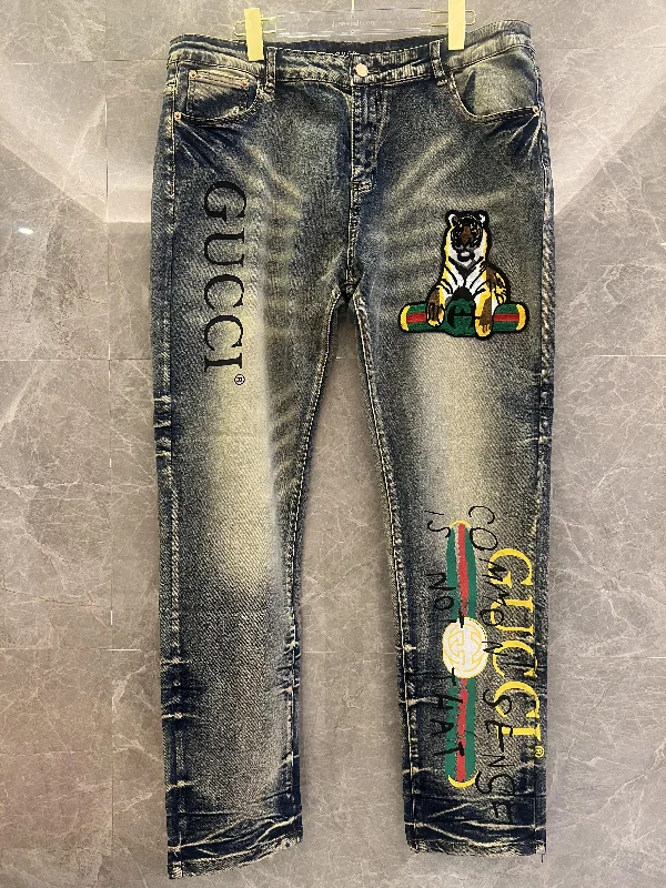Gucci printed denim jeans with tiger motif and iconic logo