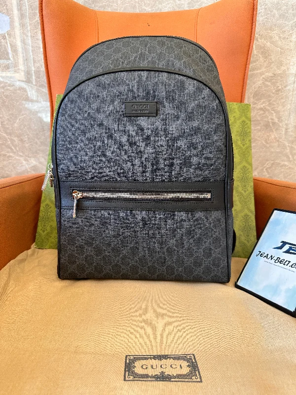 Gucci GG Supreme backpack with red and blue straps